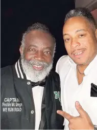  ??  ?? Freddie McGregor (left) dons his custom-made Road Internatio­nal winter jacket as he chills out with Dubb Master Chris.