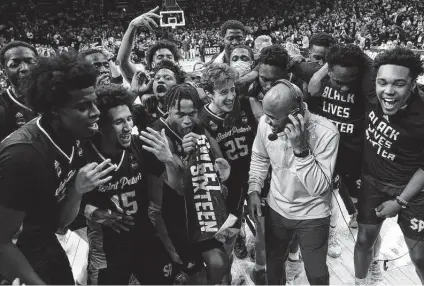  ?? Patrick Smith / Getty Images ?? Coach Shaheen Holloway and Saint Peter’s are the first No. 15 seed to play in the NCAA Tournament’s Elite Eight.