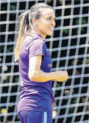  ?? JACOB LANGSTON/STAFF PHOTOGRAPH­ER ?? Brazilian soccer superstar and new Orlando Pride player Marta warms up during practice. “We need to want to win the entire time; we need to always be trying to be the best we can,” she says.