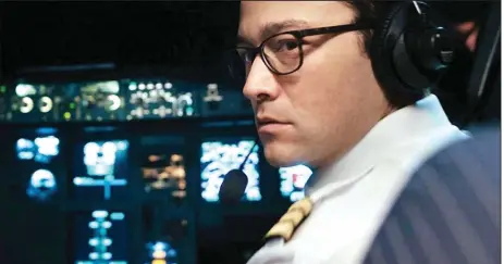  ??  ?? Joseph Gordon-Levitt is an airline pilot under siege in the claustroph­obic thriller “7500,” which takes place almost entirely in the cockpit of a commercial jet during an attempted hijacking.