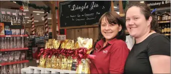  ??  ?? Anyone for Christmas drinks?... Caroline Noonan and Off-Licence Supervisor Cliona Ekran in the multi award-winning off-licence in Garvey’s SuperValu, Dingle.