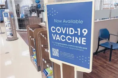  ?? DAVID ZALUBOWSKI/AP ?? A sign at a grocery store in Monument, Colo. Millions of U.S. workers have a Jan. 4 deadline to get a COVID-19 vaccine.