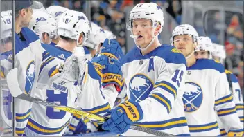  ?? AP PHOTO ?? Buffalo Sabres Jack Eichel celebrates a goal with his teammates during the 2018-19 NHL season.