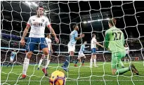  ??  ?? Raheem Sterling, centre, celebrates after scoring Manchester City’s second goal in their 3-1 win over Bournemout­h.