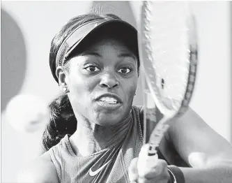  ?? CHRISTOPHE ENA THE ASSOCIATED PRESS ?? Sloane Stephens of the U.S. returns a shot against Poland’s Magdalena Frech during their second-round match at the French Open tennis tournament in Paris on Wednesday. Stephens won, 6-2, 6-2.