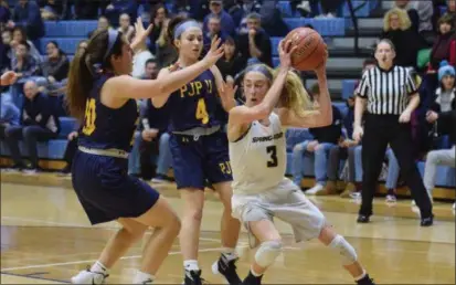  ?? AUSTIN HERTZOG - MEDIANEWS GROUP ?? Spring-Ford’s Lucy Olsen (3) is defended by Pope John Paul II’s Lexi Bray (20) and Grace Hilferty (4).