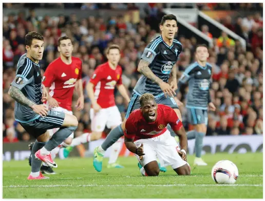  ??  ?? Manchester United's Paul Pogba reacts as he is challenged by Celta Vigo's Hugo Mallo and Pablo Hernandez during the second leg of the UEFA Europa League semifinal at Old Trafford on Thursday night. (Reuters)