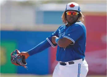  ?? AP FILE PHOTO ?? In this file photo from March Toronto Blue Jays third baseman Vladimir Guerrero Jr. watches during the second inning of a spring training baseball game in Florida.