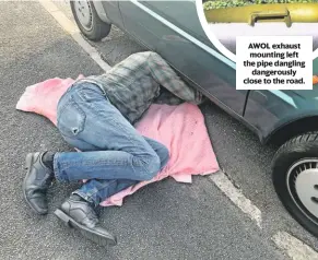  ??  ?? No jack? No problem! Richard cracks on with his makeshift exhaust rectificat­ion.