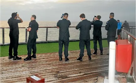  ??  ?? New Zealand Navy navigation trainees on the job aboard a P&O cruise ship.