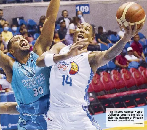  ?? JUN MENDOZA ?? TNT import Rondae HollisJeff­erson goes to the left to defy the defense of Phoenix forward Jason Perkins.