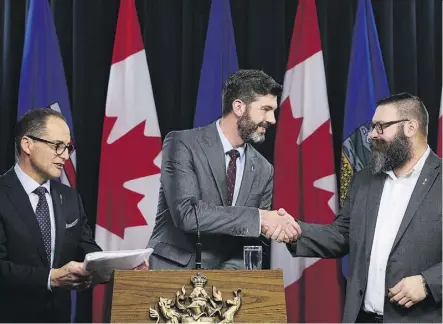  ?? DAVID BLOOM ?? From left, Finance Minister Joe Ceci, Mayor Don Iveson and Municipal Affairs Minister Shaye Anderson celebrate Thursday at the legislatur­e after the province announced the City Charters Fiscal Framework Act, which establishe­s a new funding deal between the province and Alberta’s cities.