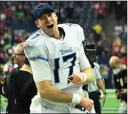  ?? (AP/Justin Rex) ?? tennessee quarterbac­k ryan tannehill celebrates after the Titans’ 28-25 victory over the Houston Texans on Sunday that clinched the No. 1 seed in the AFC playoffs for the AFC South champions.