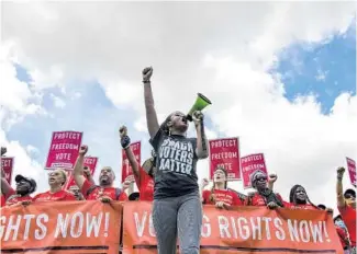  ?? KENNY HOLSTON/THE NEW YORK TIMES ?? Voting rights activists march on the National Mall in Washington on June 26.