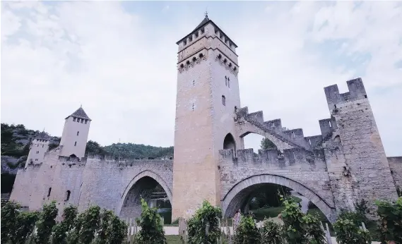  ?? PHOTOS: JIM BYERS ?? Pont Velantré is a stunning stone bridge in Cahors, France, an Instagram-worthy city that attracts outdoor enthusiast­s, as well as wine lovers and foodies.