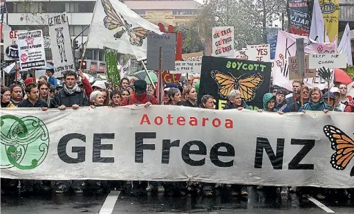  ??  ?? Protesters march against genetic engineerin­g in Auckland.