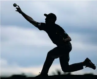  ?? DAX MELMER/The Windsor Star ?? LaSalle Titans’ Thomas Penner throws a pitch against the Tecumseh
Thunder U-18 at Villanova Tuesday.