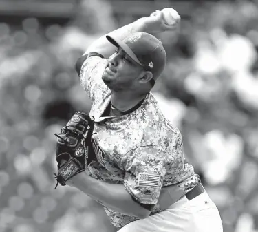  ?? Associated Press ?? n San Diego Padres starting pitcher Jhoulys Chacin throws to the plate against the Los Angeles Dodgers during the first inning of a baseball game Sunday in San Diego.