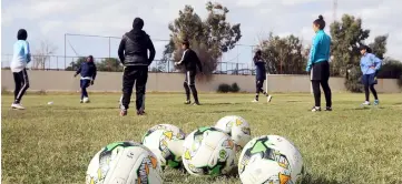  ??  ?? Photos show Libya’s women footballer­s taking part in training in Tripoli ahead of their first African Cup qualifiers. — AFP photos