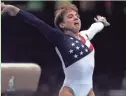  ?? AP ?? Kerri Strug reacts after injuring her left leg during a landing in competitio­n at the Atlanta Games.