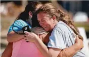  ?? Picture: GETTY ?? Elizabeth Hanson and her daughter, Emaly Hanson hug a neighbour in Mexico Beach.
