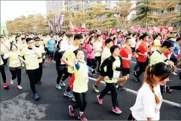  ?? AFP ?? Runners take part in a half marathon in Xiamen, in China’s Fujian province, on December 10.