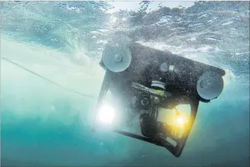  ?? Misael Virgen San Diego Union-Tribune ?? THE BEAGLE, a remotely operated vehicle, plunges into the water near the Channel Islands. The expedition was part of the nonprofit Oceana’s effort to secure new protection for a large swath of West Coast waters.