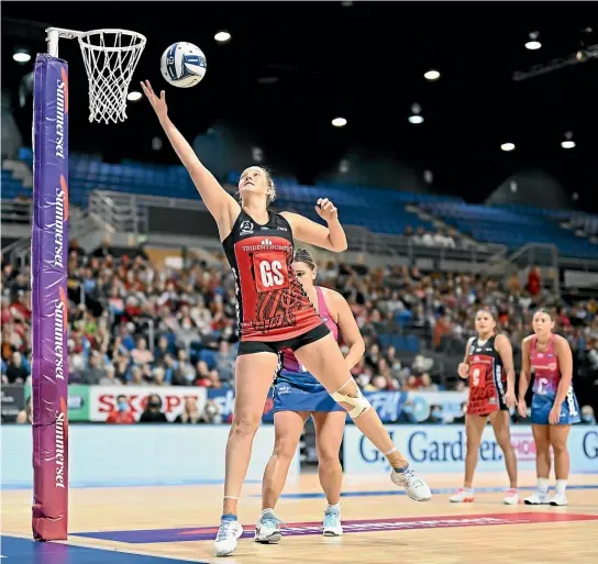  ?? GETTY IMAGES ?? Tactix goal shoot Ellie Bird was again in top form, netting 43 goals from 44 attempts. Bird, along with captain Kimiora Pio, inset, led the Tactix to victory over southern rivals, the Southern Steel.