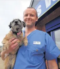  ?? Candid PR ?? White Cross Vets Clinic Director and vet Archie Cummings with his pet Maggie