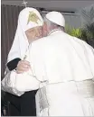  ?? ISMAEL FRANCISCO/CUBADEBATE VIA AP ?? Patriarch Kirill, head of the Russian Or thodox Church, kisses Pope Francis a s they meet at the airpor t in Havana on Friday.