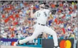  ?? John Minchillo The Associated Press ?? White Sox pitcher Lucas Giolito throws during his scoreless fourth inning for the AL in the Allstar Game on Tuesday in Cleveland.