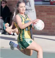  ??  ?? Garfield centre Britney Collis provides a strong drive down the sideline in the 17 and under game against Bunyip in West Gippsland netball.