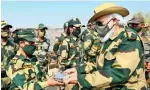  ?? PTI ?? Prime minister Narendra modi presents sweet boxes to army soldiers while celebratin­g Diwali with them in jaisalmer on saturday. —
