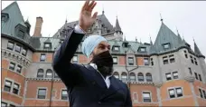  ?? The Canadian Press ?? New Democratic Party Leader Jagmeet Singh waves to a pedestrian during a campaign stop in Quebec City, Friday.