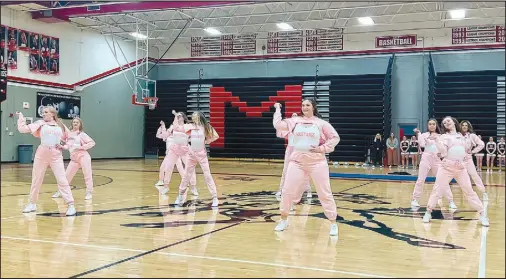  ?? Alexus Underwood/Special to McDonald County Press ?? MC Pom performing one of several routines at the Spirit Showcase. Friends and families during the performanc­e.
filled the gymnasium with applause