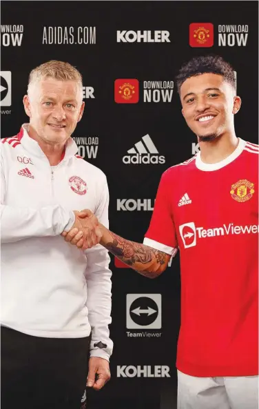  ?? Courtesy: Manchester United Twitter ?? Jadon Sancho (right) poses for a photograph with Manchester United manager Ole Gunnar Solskjaer after joining the club on Friday.