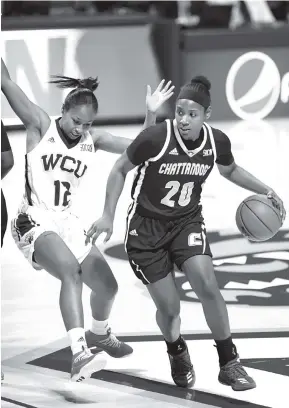  ?? STAFF PHOTO BY ROBIN RUDD ?? UTC’s Keiana Gilbert has excelled in her second stint at point guard. Gilbert averaged 18.5 points, 4.5 assists and 3.5 rebounds per game last week.