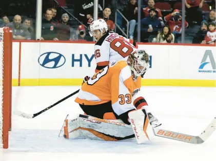  ?? ADAM HUNGER/AP ?? Goalie Sam Ersson took his first NHL loss over the weekend in a blowout loss to the Devils and is now back with the Phantoms. But for how long?