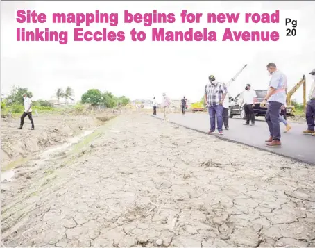  ?? (Office of the President photo) ?? President Irfaan Ali and Minister of Housing and Water Collin Croal inspecting the work done on a section of the asphalted road between Eccles to Diamond