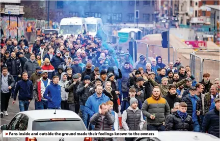  ?? ?? Fans inside and outside the ground made their feelings known to the owners