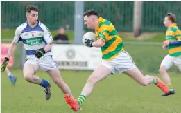  ??  ?? St. Kevins’ Damien Buckley looks to take on Killavulle­n’s Kevin Fox during last weekend’s O’Sullivan Lewis U-21 ‘C’ FC Final in Mourneabbe­y.