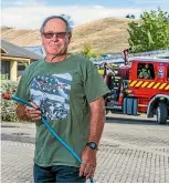  ?? RICKY WILSON / FAIRFAX NZ ?? Reg Tasker helped extinguish a scrub fire just metres from his home.