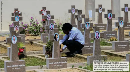  ??  ?? SECOND ANNIVERSAR­Y: A man pays his respects at the graves of the 2019 Easter attacks victims in Katuwapiti­ya last Sunday (4)