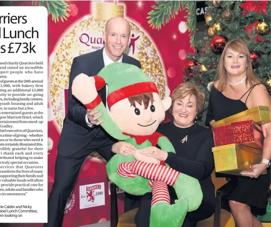  ??  ?? Good elf Marjorie Calder and Nicky Martin from the Noel Lunch Committee, with Des McKeown looking on