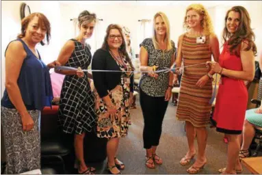  ?? PHOTOS BY LAUREN HALLIGAN — LHALLIGAN@DIGITALFIR­STMEDIA.COM ?? A ribbon-cutting ceremony during the grand opening of the new Baby Café at the Commission on Economic Opportunit­y’s Community Resource Center in Troy, on the third floor of the 23285th Ave. building.