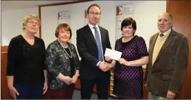  ??  ?? athal Lombard of Cathala Lombard Solicitors presenting a sponsoring cheque to Roisin Moriarty and commiteee members.