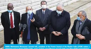  ?? — AFP ?? PARIS: Mohammed Moussaoui (second left), president of the French Council of the Muslim Faith (CFCM) makes a statement next to Chems-Eddine Hafiz, rector of Paris’ great Mosque (second right) and other CFCM representa­tives, including Assani Fassassi (left) after signing a “charter of principles” requested by President Macron.