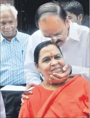  ?? SUSHIL KUMAR/HT ?? BJP leaders Venkaiah Naidu and Uma Bharti outside Parliament on Wednesday.