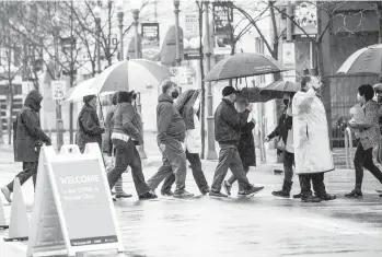  ?? ANDREW RUSH/PITTSBURGH POST-GAZETTE ?? People line up for COVID-19 shots Thursday outside PNC Park in Pittsburgh. The U.S., which has ramped up vaccinatio­ns, is finalizing plans to send doses of AstraZenec­a vaccine to Canada and Mexico.