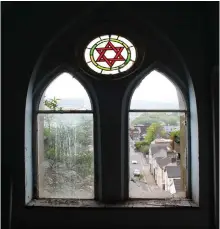  ?? (Photos: Foundation for Jewish Heritage) ?? STAR OF David stainedgla­ss window in the Wales synagogue.